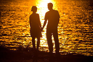 couple on beach at sunset