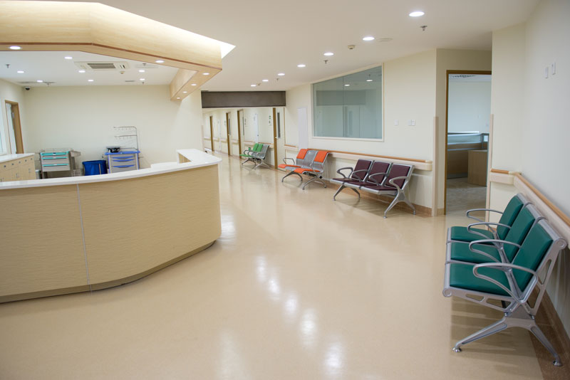 Image of interior of hospital showing empty hospital beds