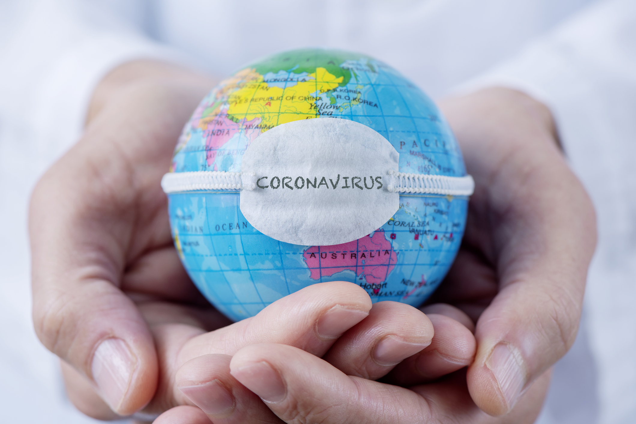 globe with a mask and text coronavirus