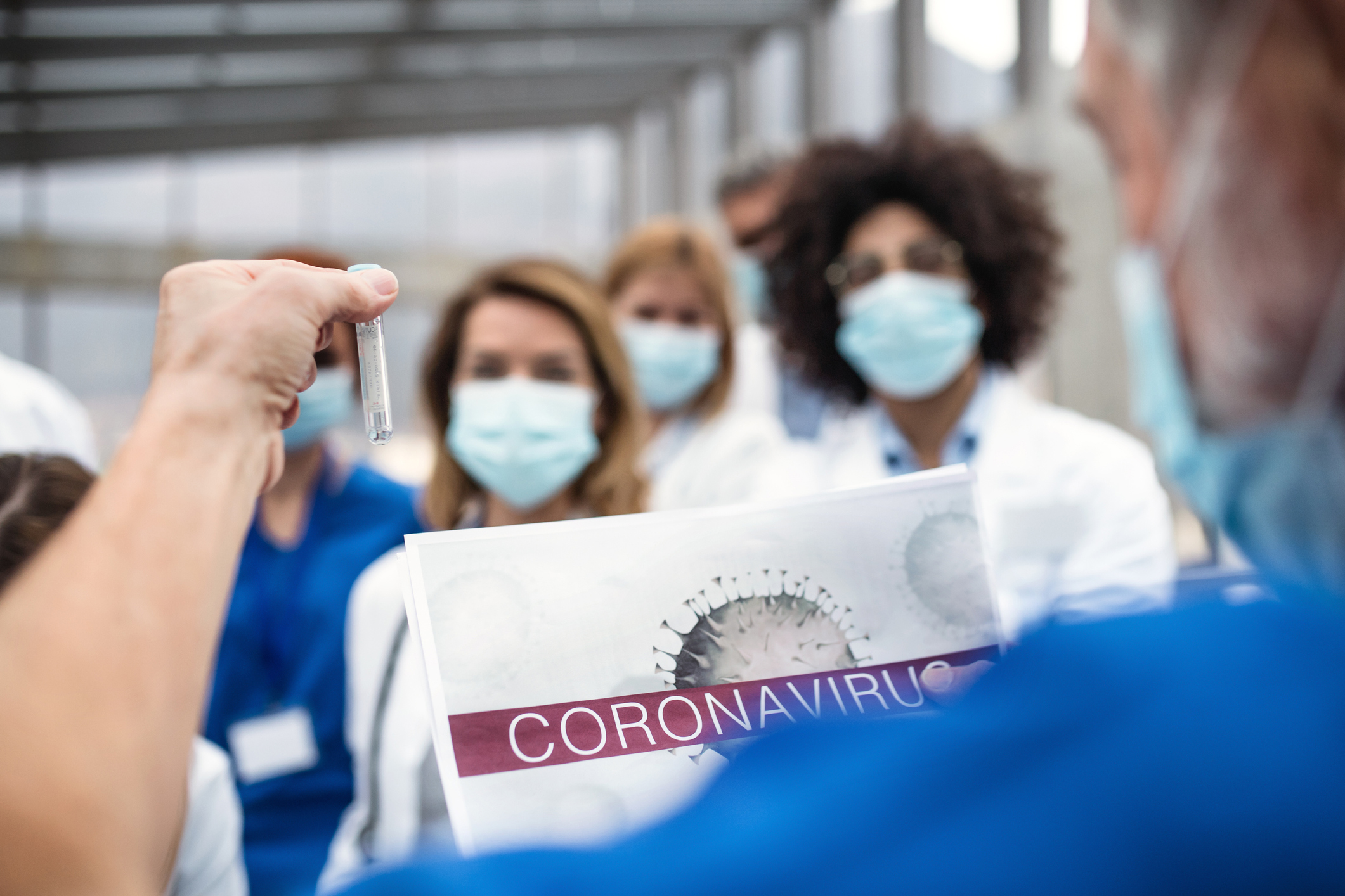 Group of doctors talking about corona virus on conference.