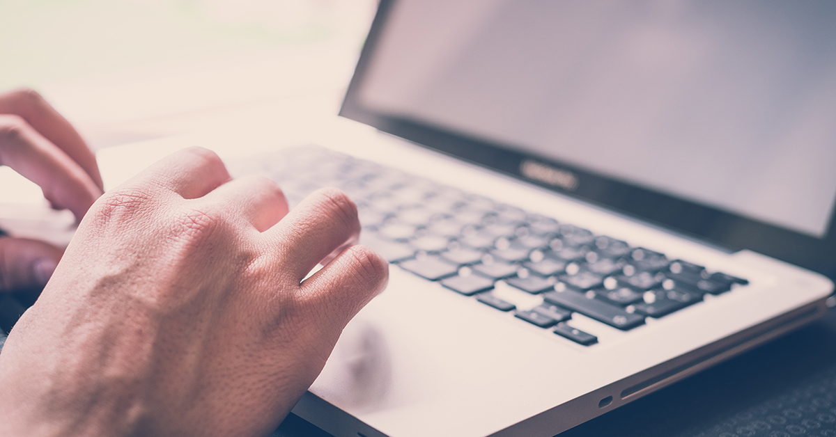 close-up-hands-on-a-laptop