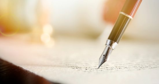 notary-or-attorney-signs-legal-contract-picture-id1147159720