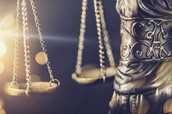 The Statue of Justice  - lady justice or Iustitia / Justitia the Roman goddess of Justice detail of scales of justice