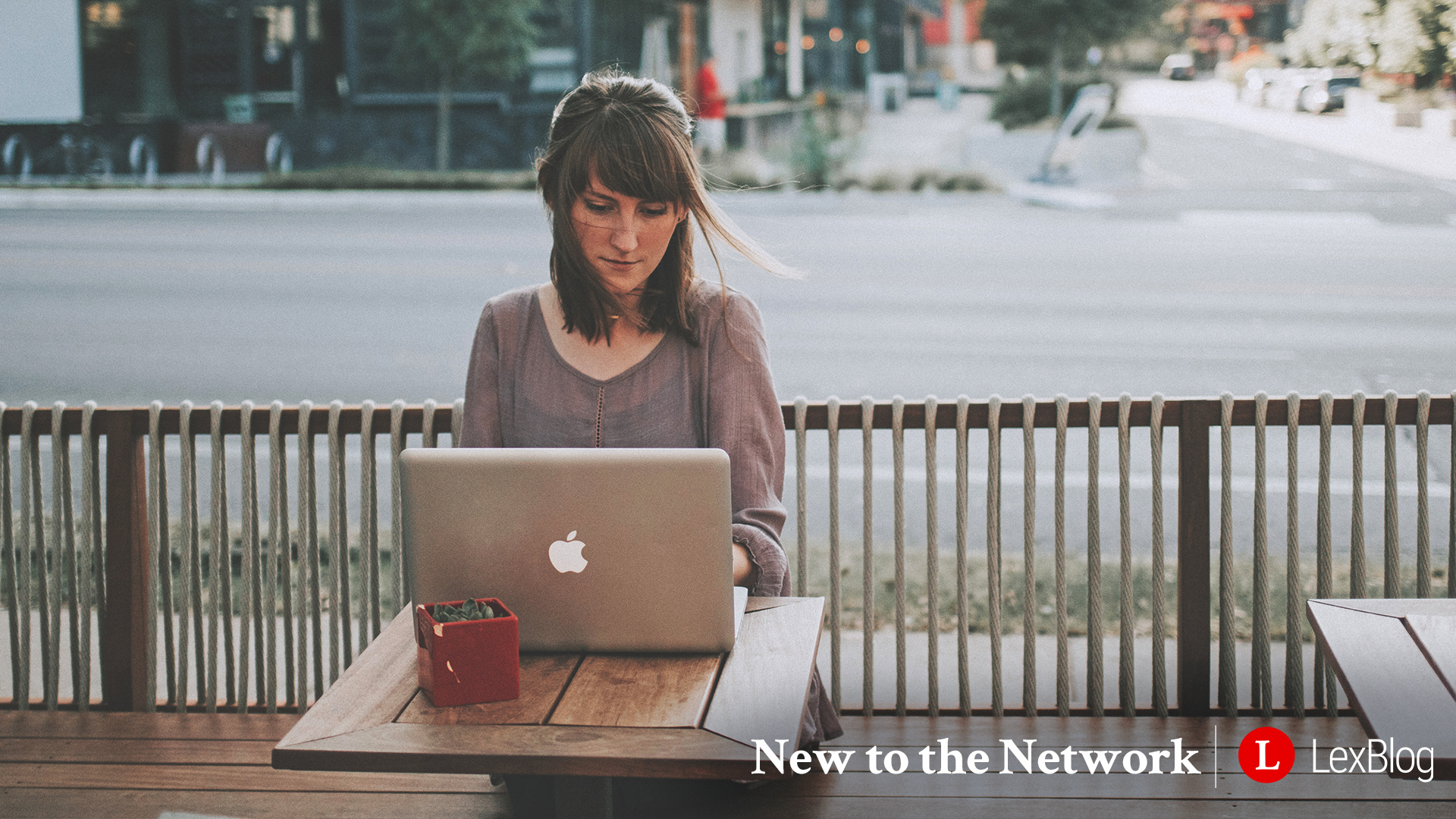 1920x1080_NewToTheNetwork_WomanOnLaptop