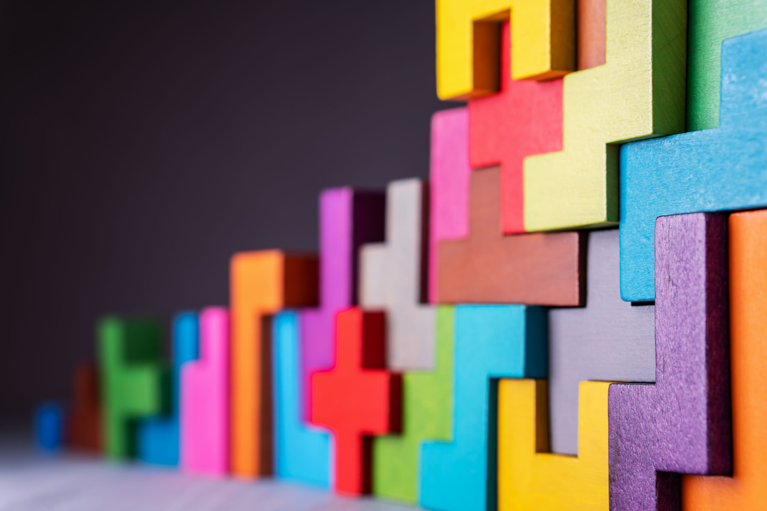 Geometric shapes on a wooden background.