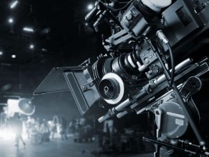 https-www-policyholderpulse-com-files-2020-10-gettyimages-1150199388-movie-scaled-e1601649667239-300x226-jpg