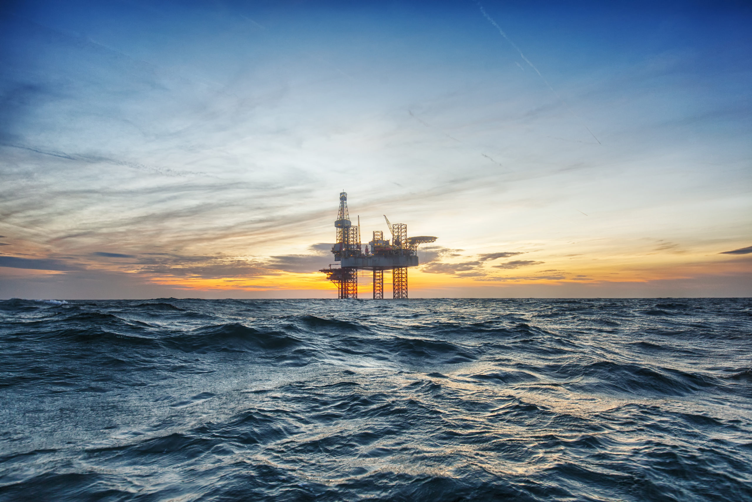 Offshore drilling rig at sunset
