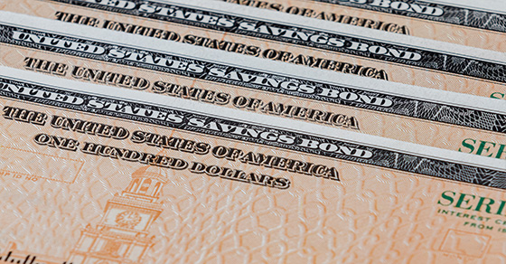 a stack of savings bonds; image used for blog post about EE bonds being taxed