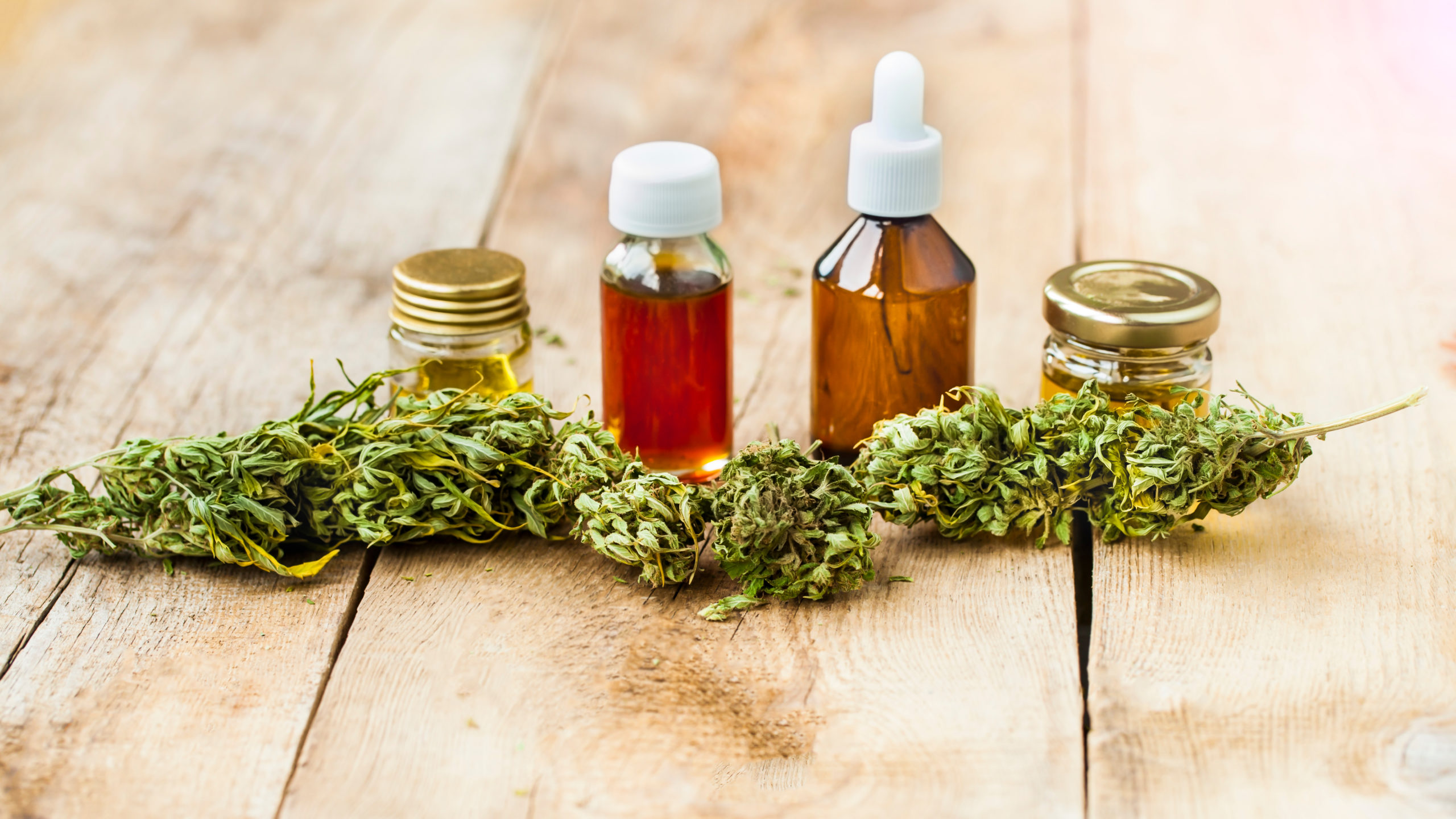 cannabis-marijuana-oil-bottles-distance-shutterstock_1176087343