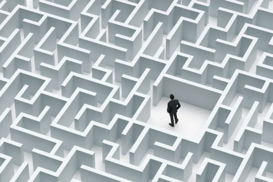 Businessman at the center of labyrinth