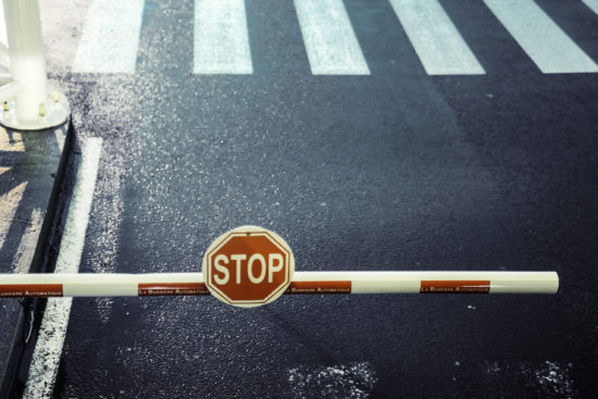 toll bar, stop sign, road, zebra crossing