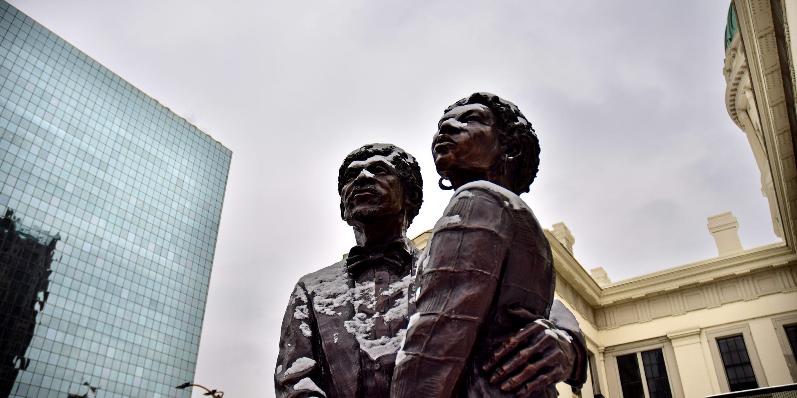 The Dred and Harriet Scott memorial statue, with Rasmussen Dickey Moore's St. Louis office in the background.
