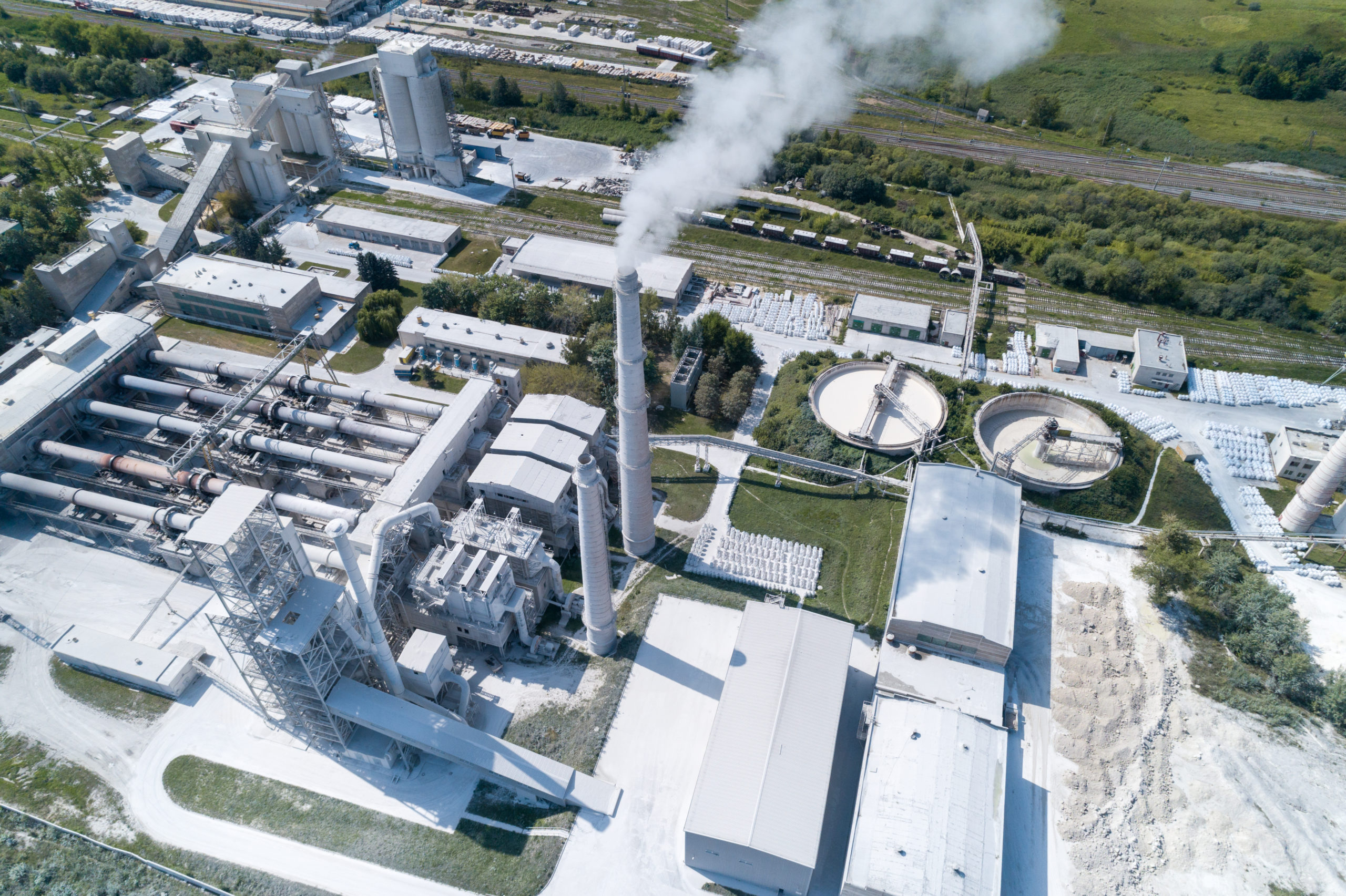 Cement factory, industrial enterprise. The smoking factory chimney