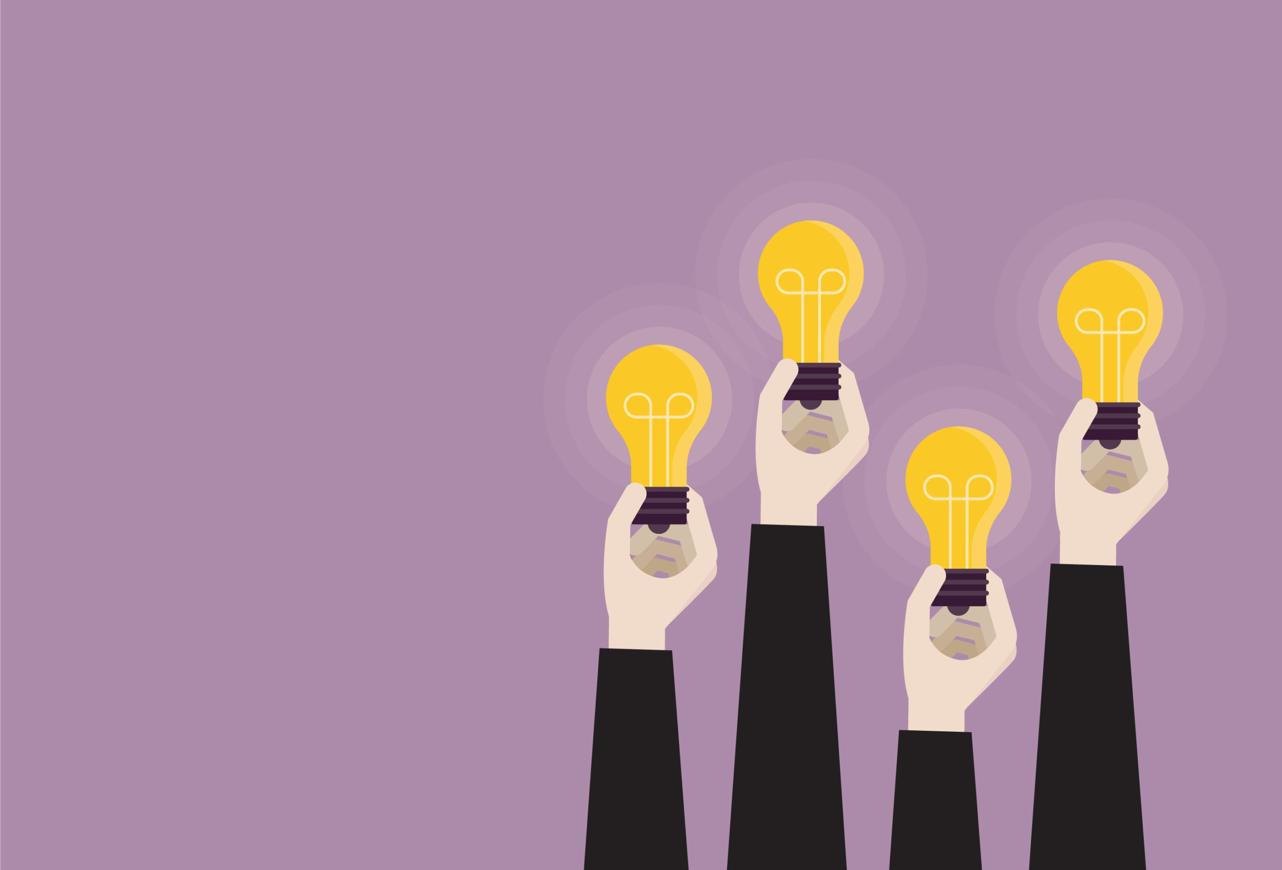 Businessperson holding a light bulb together