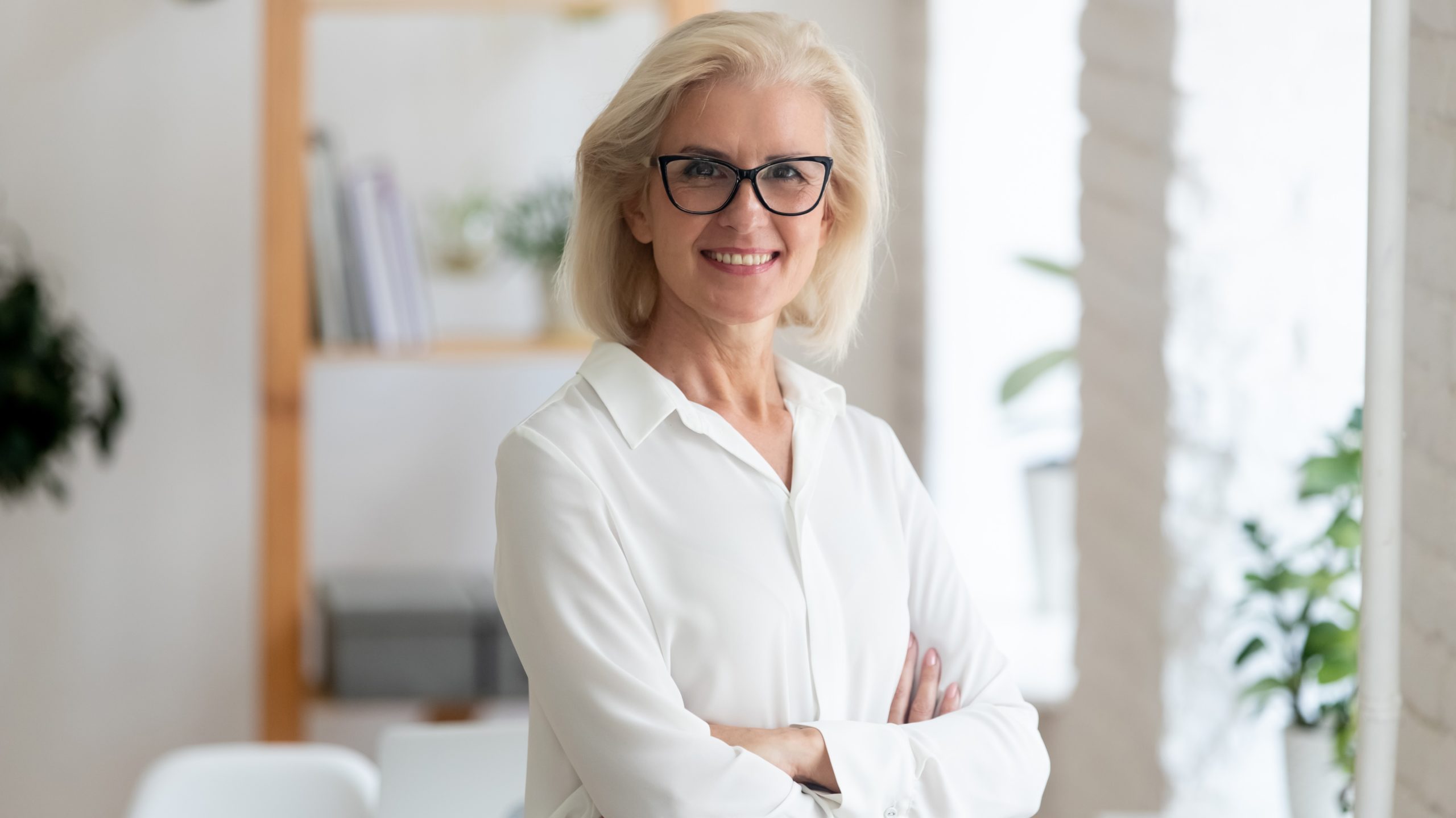 Portrait of smiling senior businesswoman posing for picture