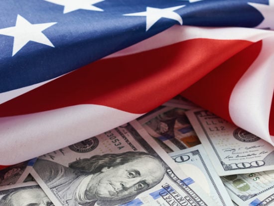 USA-national-flag-and-dollar-bills.-Business-and-finance-concept