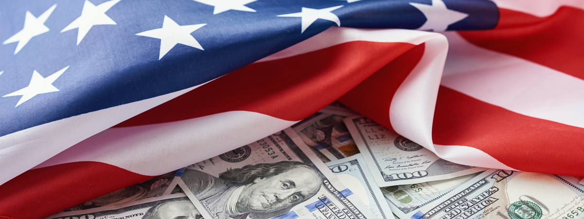 USA-national-flag-and-dollar-bills.-Business-and-finance-concept