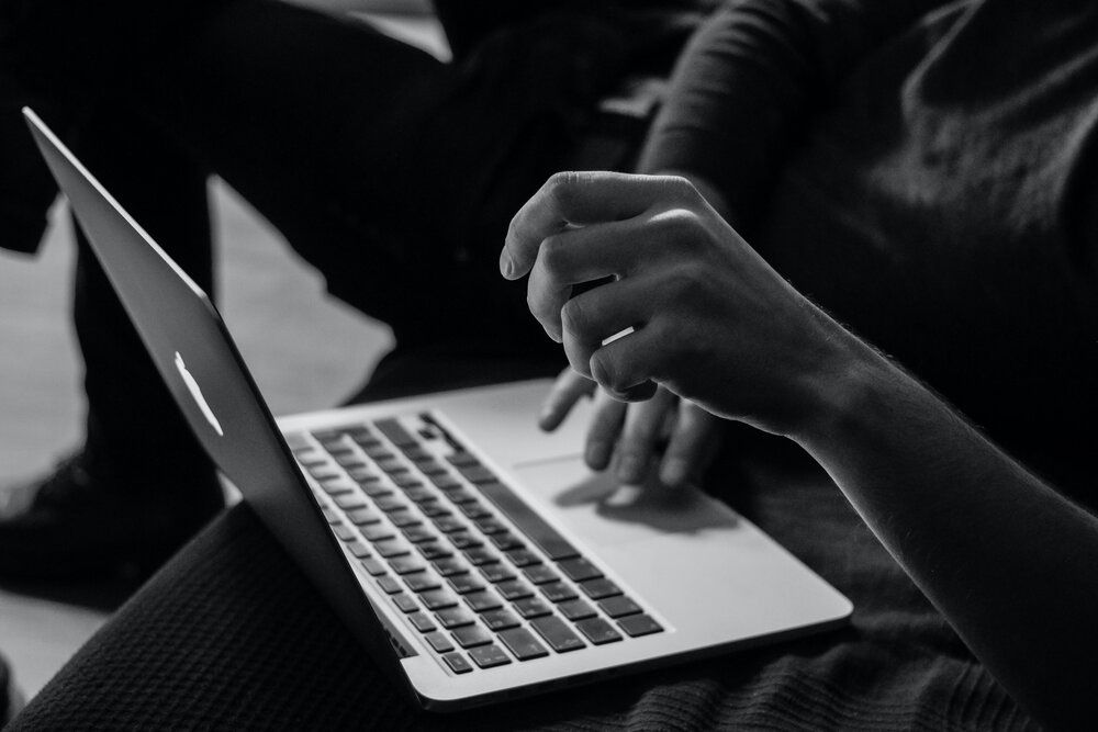 person using MacBook.jpg