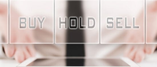 Businessman offering a choice for stock traders of buy, hold or sell in a conceptual image