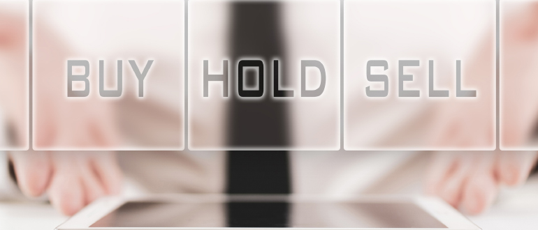Businessman offering a choice for stock traders of buy, hold or sell in a conceptual image