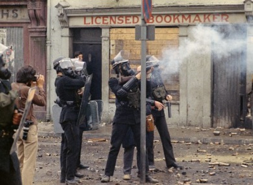 Riot police wearing helmets and gas masks during disturbances on 13 August 1969.