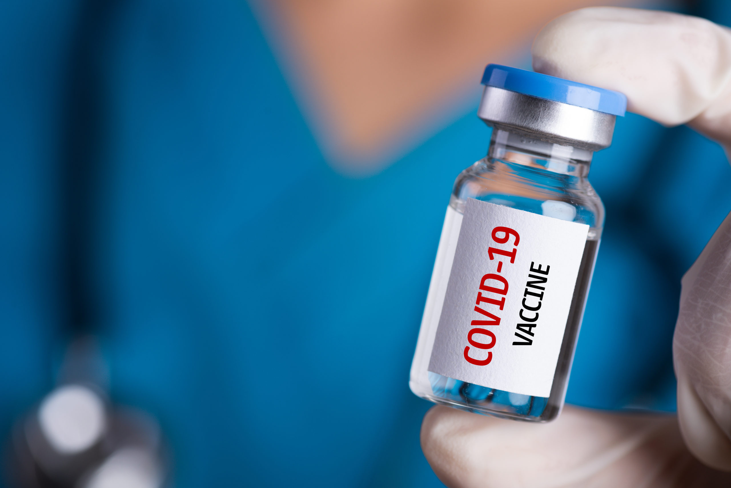 Female,Doctor,With,A,Stethoscope,On,Shoulder,Holding,Syringe,And