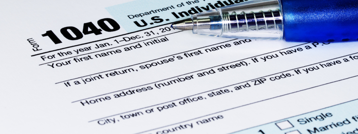 1040 Tax Return Form with a Pen