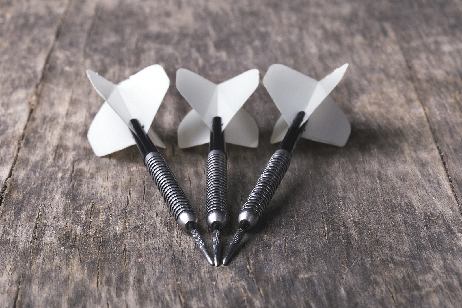 Darts on wooden table