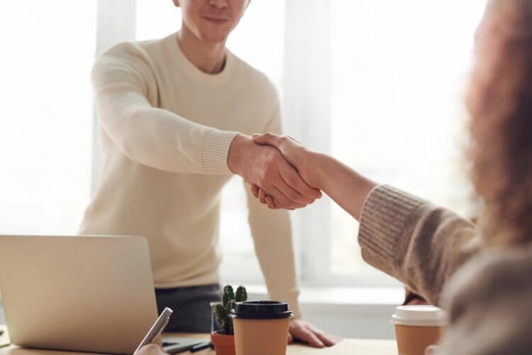 pexels-fauxels-3184465 two people shaking hands