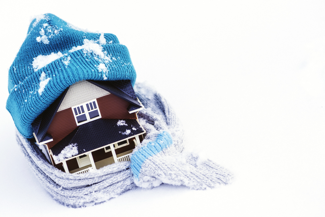 House Wrapped in Winter Clothing; Insulate Your Home