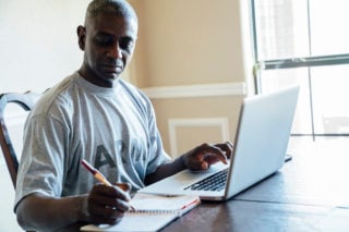 https-financialservicesperspectivesv2-babc-blogs-com-wp-content-uploads-sites-44-2021-08-army-veteran-working-on-laptop-and-paperwork_gettyimages-672155733-320x213-jpg