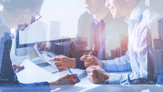 two overlay images - city landscape in the background and three business professionals looking at charts and data; image used for blog post about TXCPA Houston CFO/Controllers Conference 2021