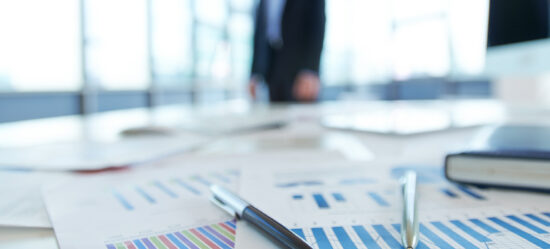 Papers,With,Financial,Data,On,Office,Table