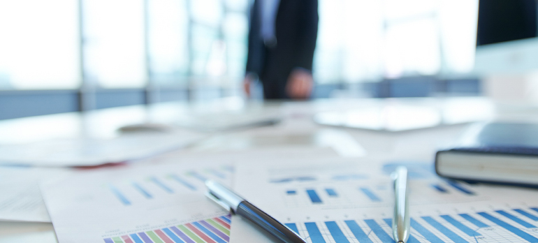 Papers,With,Financial,Data,On,Office,Table
