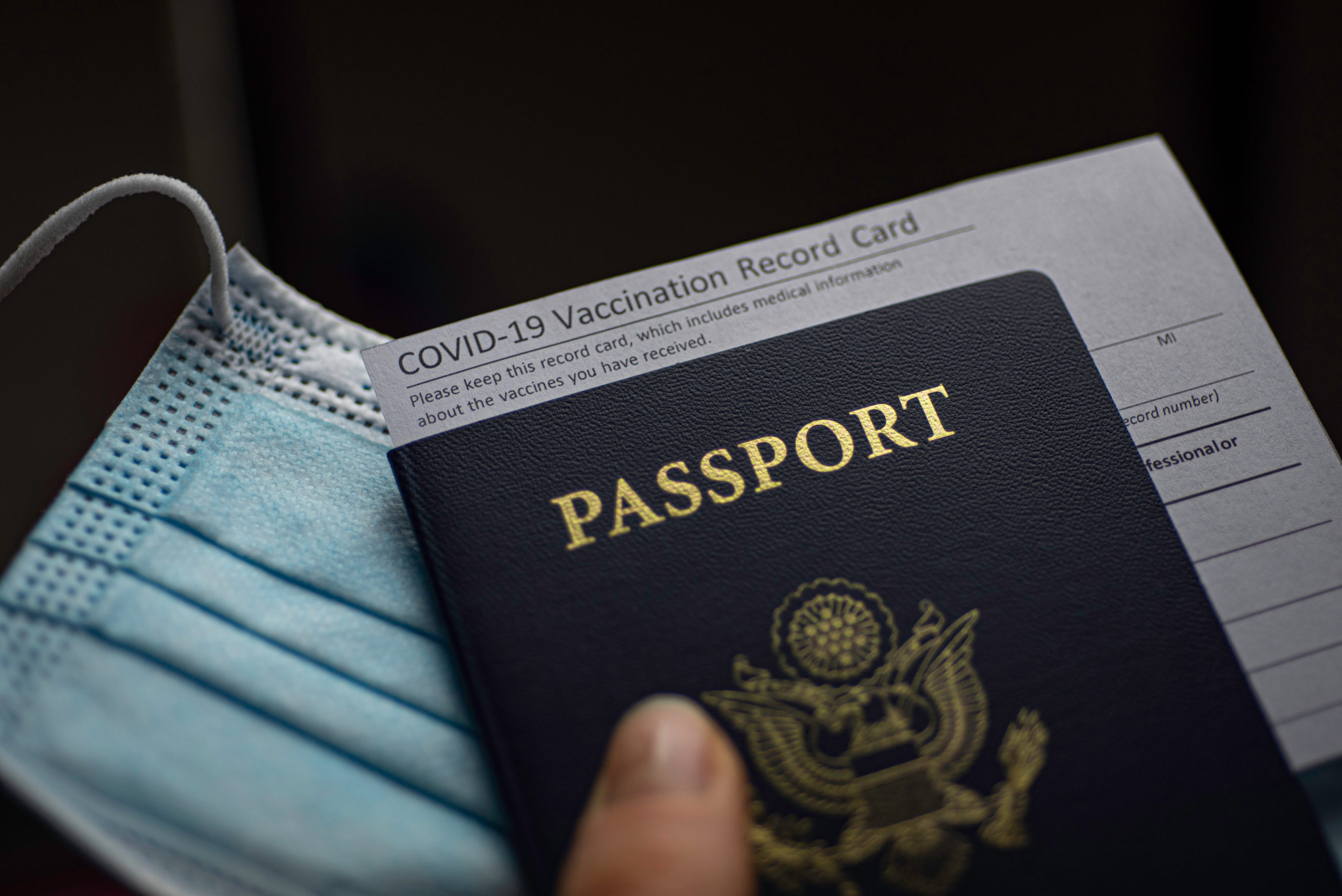 Blurred,Covid-19,Vaccination,Record,Card,,Passport,Of,Usa,And,Medical