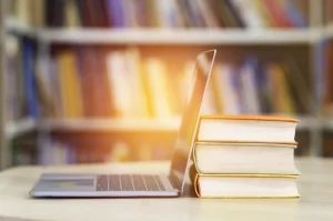 computer and books representing research on retroactive laws