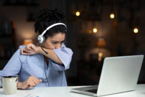 https-employmentlawinsightsfullservice-babc-blogs-com-wp-content-uploads-sites-36-2021-10-working-from-home-coughing-headset-laptop-female-gettyimages-1312293103-300x200-jpg