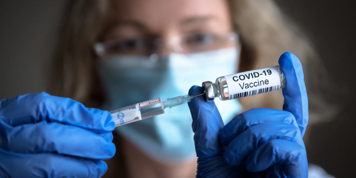 COVID-19 coronavirus vaccine in doctor hands