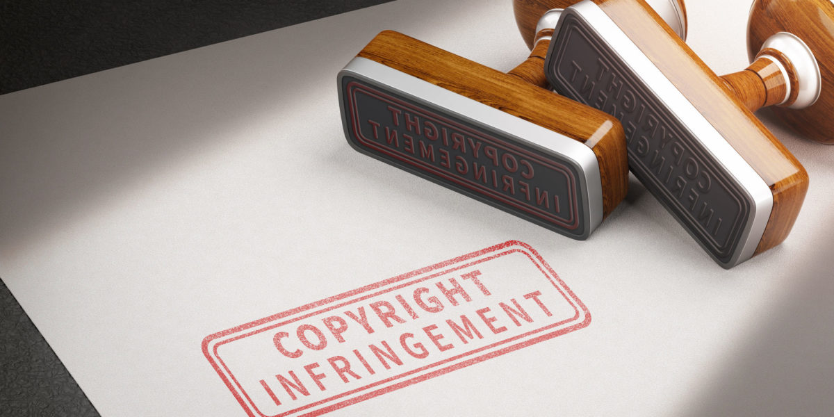 Copyright infringement letters and rubber stamps. 3d illustration