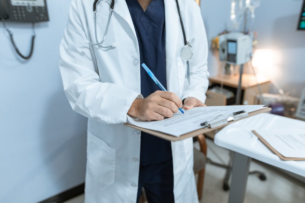 Doctor with Medical Bills