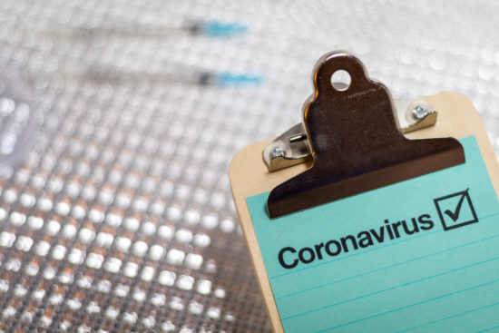 Coronavirus 2019-nCOV medical still life concept on clipboard wi