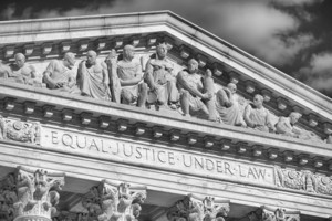 Close-up in black and white of the message "Equal Justice Under Law" inscribed in the classically detailed US Supreme Court building in Washington, DC, USA
