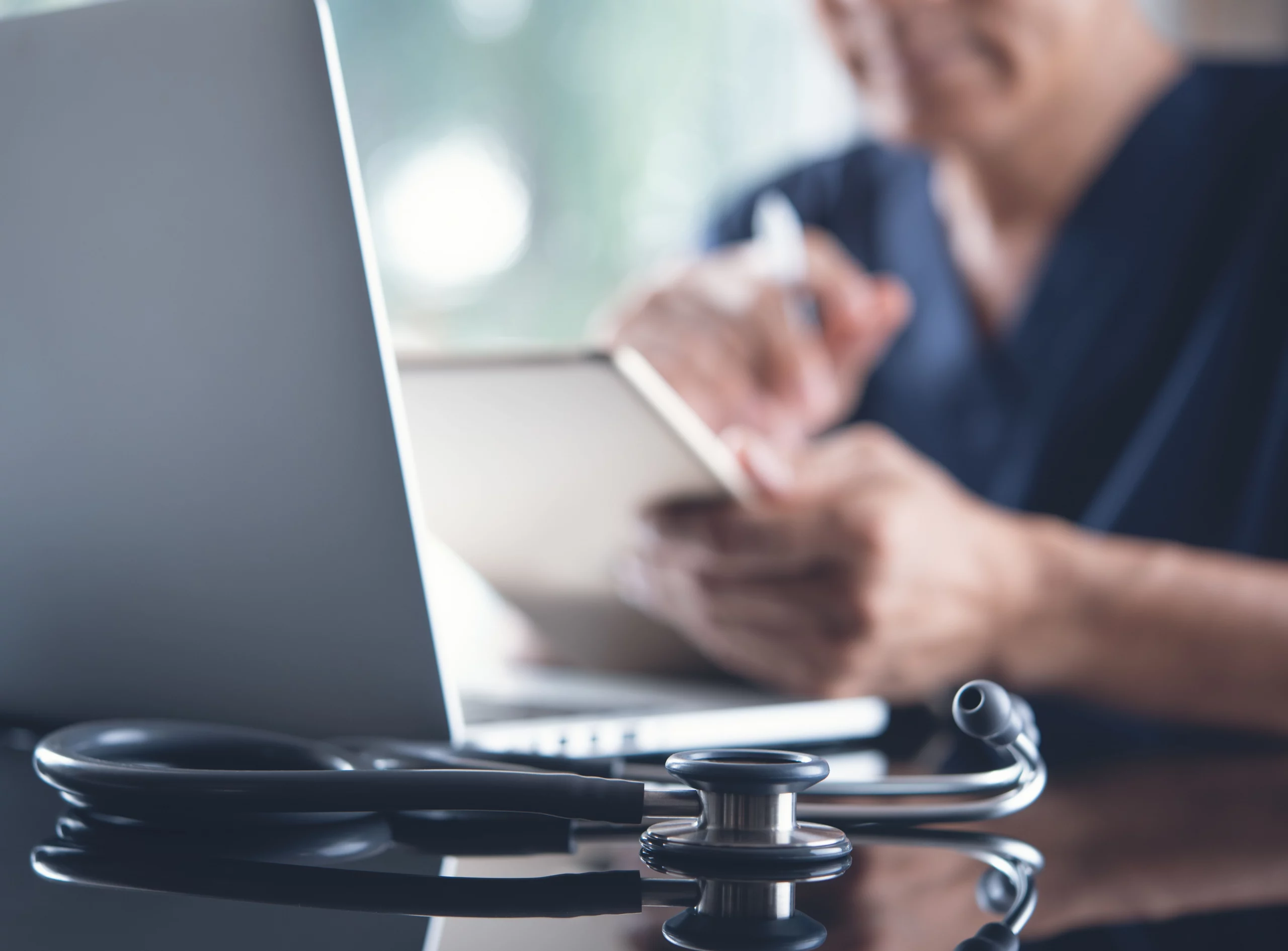 Doctor working on laptop computer