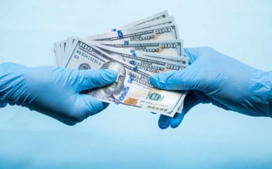 Doctors in blue gloves