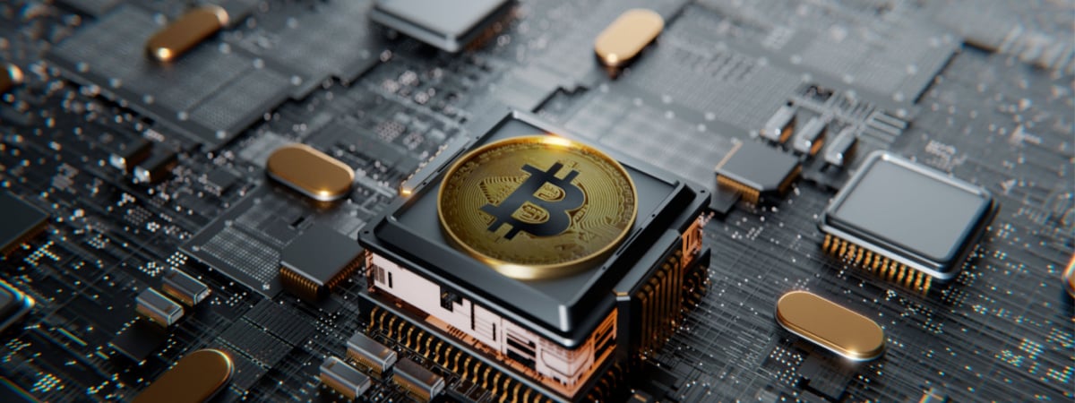 Bitcoin over a microprocessor in a motherboard-Shutterstock_1985279114