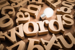 Wooden words scattered on a table