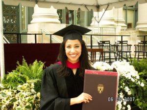 Erika Harold holding degree from Harvard Law 