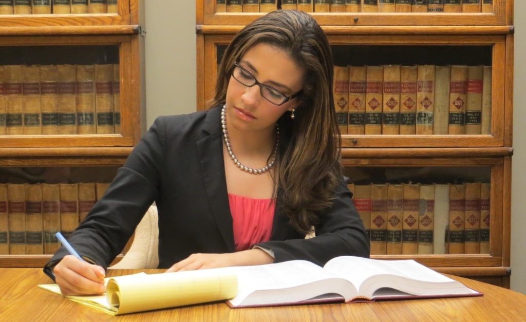 Erika Harold sitting at a desk