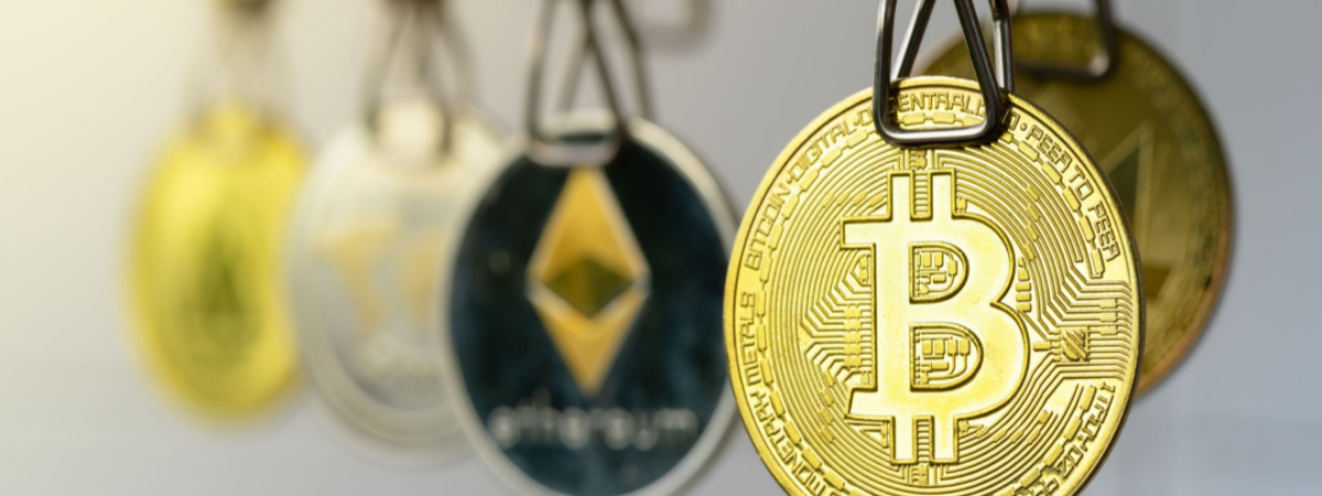 Money Laundering. Bitcoin coins hanging on clotheslines-Shutterstock_1437371309