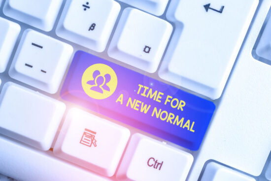 Time For A New Normal. Concept meaning Make a big dramatic change Replace the expected White pc keyboard with empty note paper above white background key copy space.